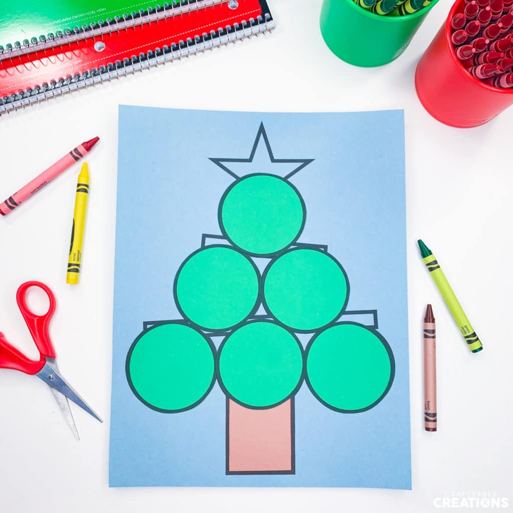 Green circles shown glued on Christmas Tree Shape Craft template.